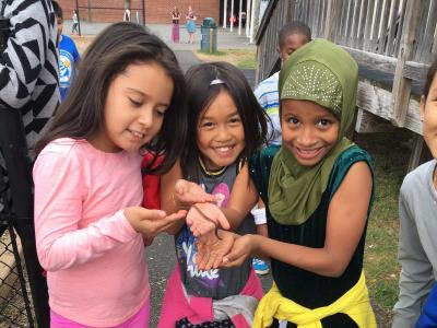 children holding a worm
